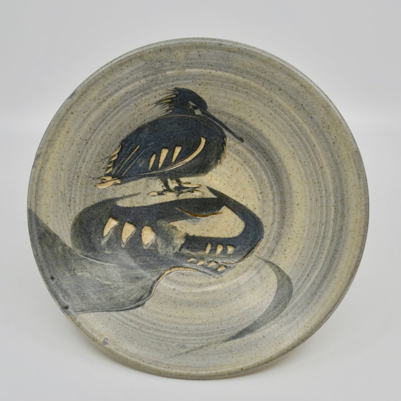 Excellent examples of a Wayne Ngan platter with carved decor of a pelican.