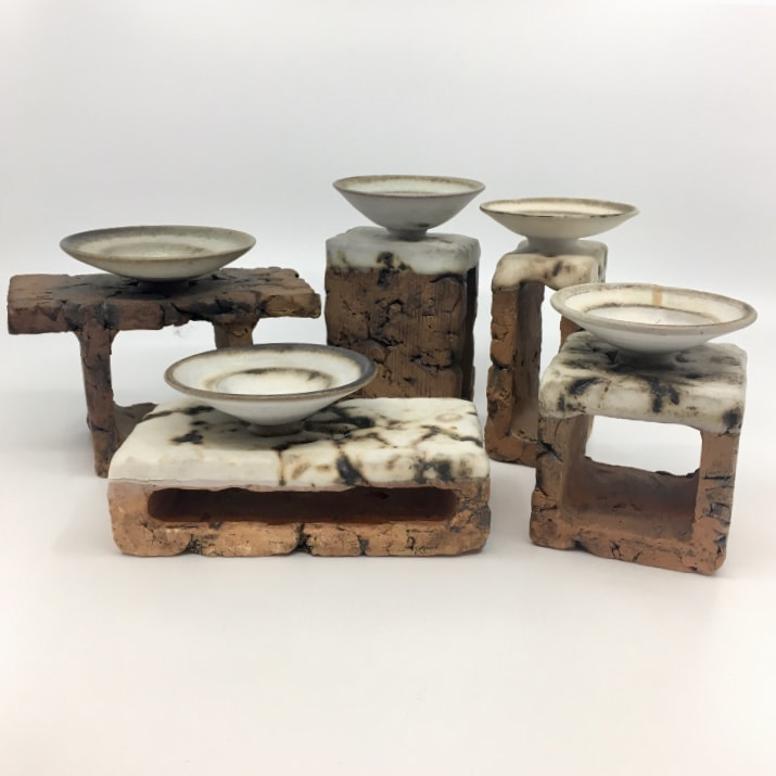 Ron Tribe candle stands - please contact me if you have examples of his pottery work to sell